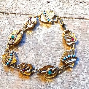 - Vintage gold charm bracelet with gems
